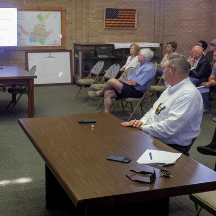 City Manager Jack Thompson (left) delivers a budget presentation before the budget hearing Tuesday night. Photos by Andy Behlen