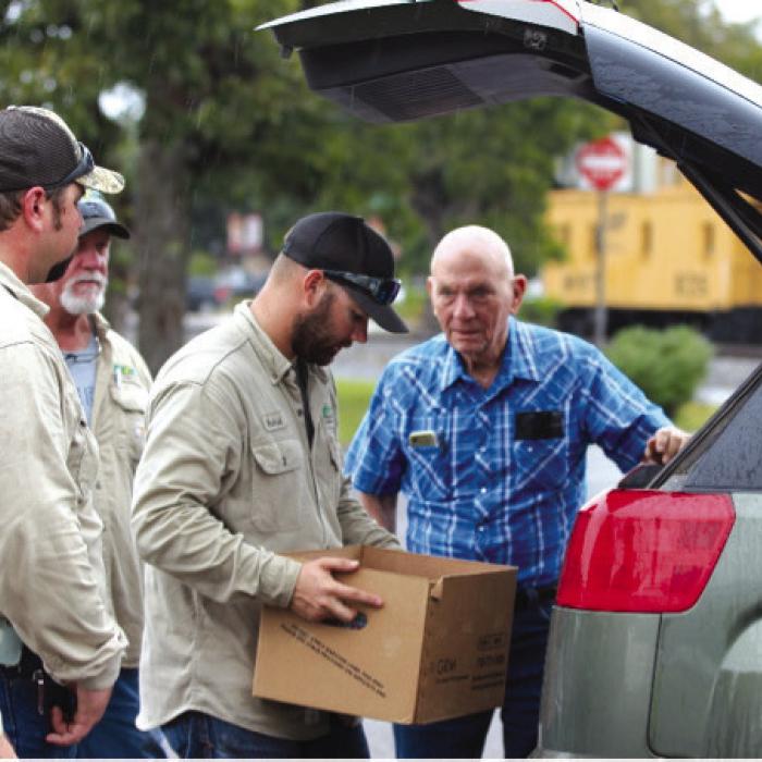 FEC employees help unload documents for shredding during last year’s Shred Day event.