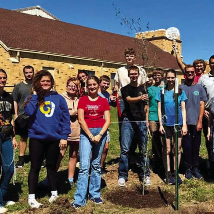 Faith Lutheran High School students with their Live Oak planted in Warda.