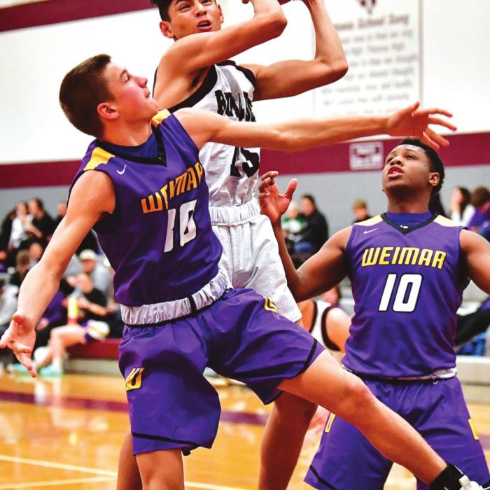 Angel Netro works through the Weimar defense to put a shot up for the Flatonia Bulldogs in Friday night’s district win over Weimar. Photo by Stephanie Steinhauser
