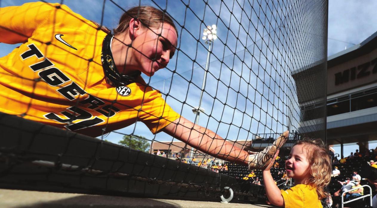 This photo of La Grange’s Hatti Moore high-fiving a young University of Missouri fan before a game last Saturday was actually picked as the NCAA Softball photo of the week in a national contest.