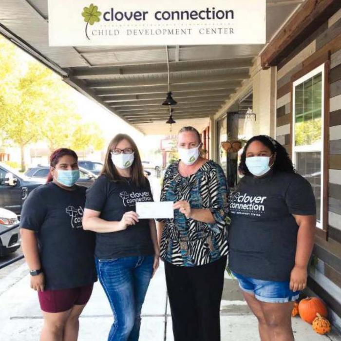Pictured from left is: Ysenia Centeno/PreK 2 teacher, Lindsay Ahrens/owner, Susie Shank/Turtle Wing Foundation managing director, and Nikki Hernandez/PreK 3 teacher.