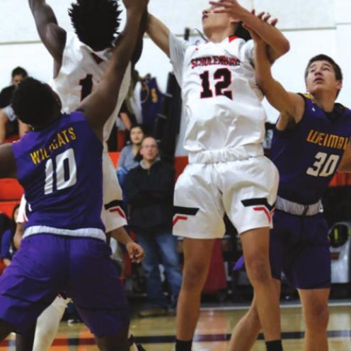 Schulenburg’s Keanu Anthony and Kael Baumgarten try to get this loose ball Friday. Photos by Audrey Kristynik
