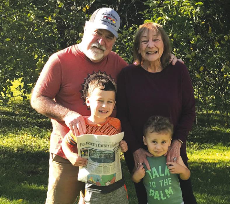 Leigh Ann and Bobby Bedient went to Michigan to see their grandchildren and took along The Fayette County Record. Both Bedients work at The Record.
