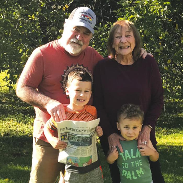 Leigh Ann and Bobby Bedient went to Michigan to see their grandchildren and took along The Fayette County Record. Both Bedients work at The Record.