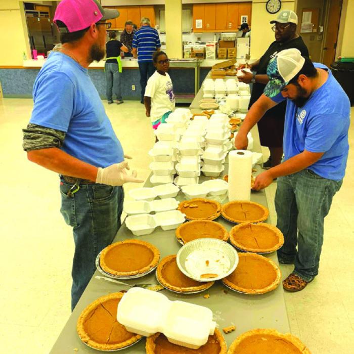 Optimist members helping at a Thanksgiving day free meal in La Grange last year.