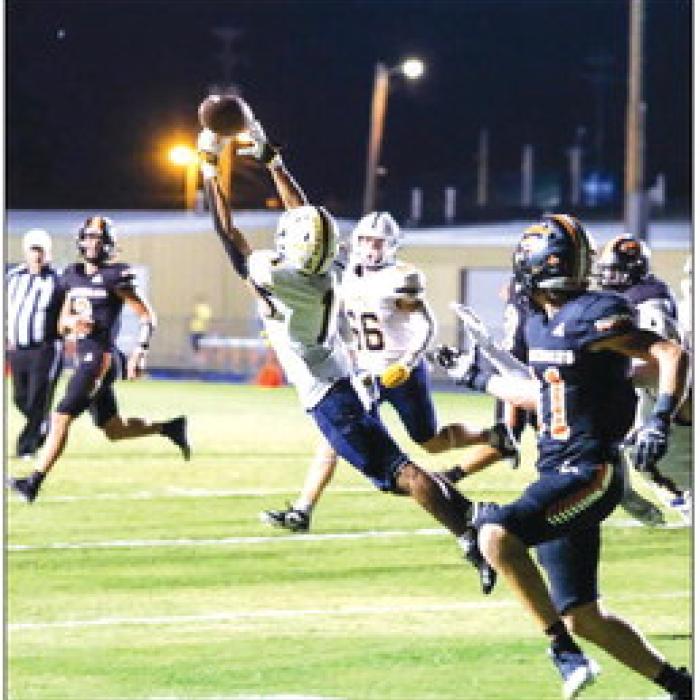 Poth’s Aidan DeHoyos tips and nearly intercepts a pass to Schulenburg’s Jayse Janda that fell incomplete.
