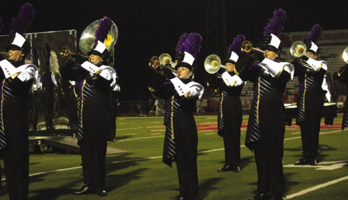 The La Grange band performs their halftime show Friday.