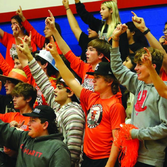 Schulenburg had a lot of students show up for Tuesday’s playoff victory over Kenedy at Nixon-Smiley. Here the students hold up “1” more point until a Lady Horns victory. Photo by Audrey Kristynik