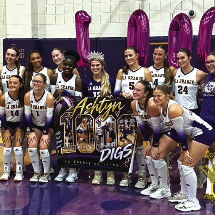 La Grange’s Ashtyn Smith celebrates her 1,000th career dig with her teammates after Friday’s victory over Sealy. LGISD photo
