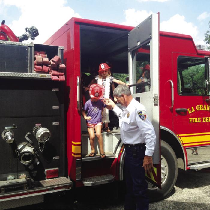 Frankie’s most gratifying community outreach activity provides local youngsters at the library in La Grange, public and private elementary schools and day care centers with the opportunity to get a close-up view of a firetruck. Photo courtesy of the Fayette Public Library, Museum and Archives.