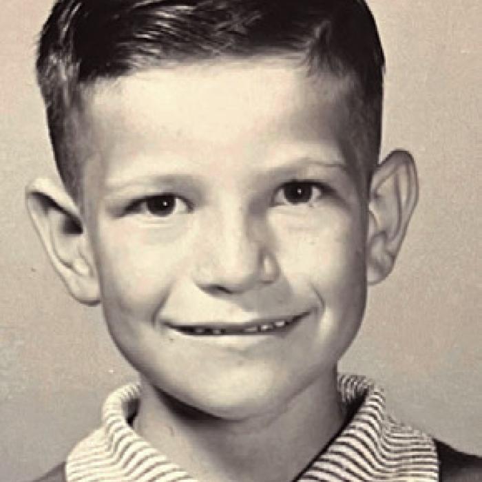 A Fayette County boy, born and bred, Frankie is pictured at left in first grade. In the middle photo, Frankie stands beside his mother and father, Frank and Mary Srubar, next to his sister, Grace. In the back row, are his sisters: Linda, Pat, Jean, Mary Ann and Rose. At far right, a delighted Frankie holds his baby brother, Mark.