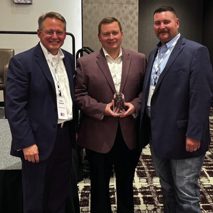 Fayette County EMS Director Josh Vandever (center) accepted the EMS Agency of the Year Award from the Texas EMS Alliance (TEMSA) at an educational conference last week. He is pictured with TEMSA President Butch Oberhoff (left) and TEMSA President-Elect Michael Furrh (right).