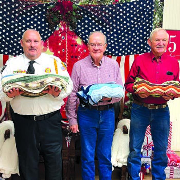 From left, Donna Wessels, donor of the crocheted lap afghans, with Veteran winners Scott Jones, Ed Matocha, Ivan Muras, and Glenn Altwein.