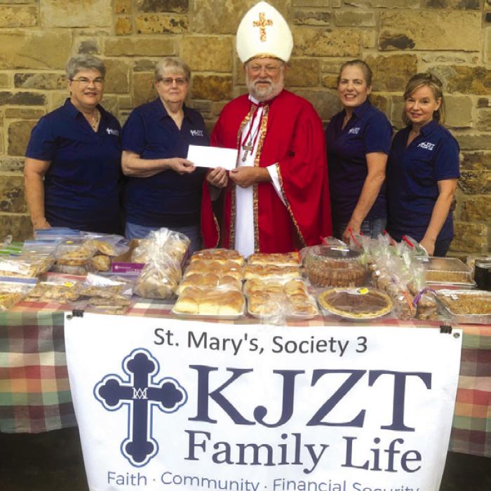 St. Nicholas (aka Pastor Herb Beyer) with members St. Mary’s KJZT Society at one of its fundraisers helping provide for needy families.