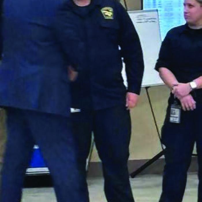 Fayette County EMS Director Josh Vandever, center, shakes hands with President Donald Trump during his visit to Kerrville Friday.