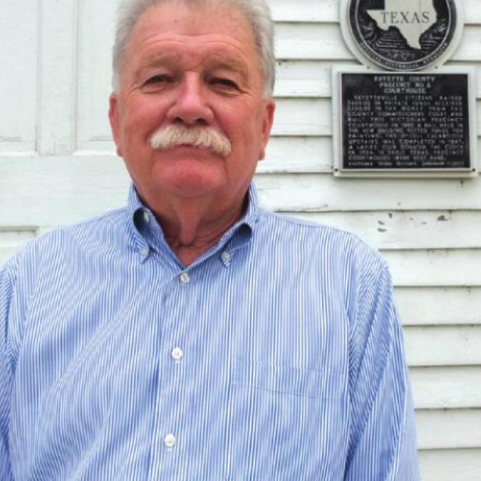Fred Roberts, photographed on the Fayetteville town square near his office, is running for State House District 85. Photo by Andy Behlen