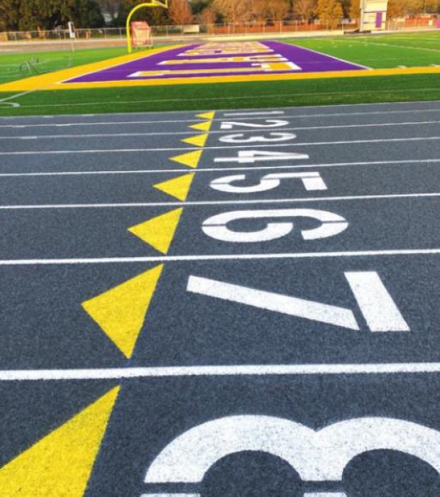 The painting of the new track at Leopard Stadium was one of the final tasks of the new turf and track project there.