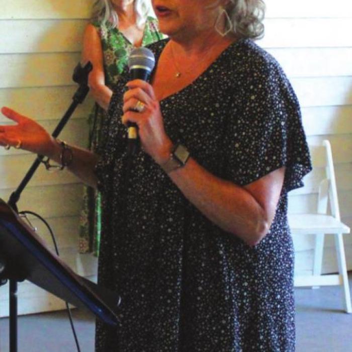 Lisa McNair, CEO of Hospice Brazos Valley talks to the crowd Saturday, thanking them for their support of the non-profit.