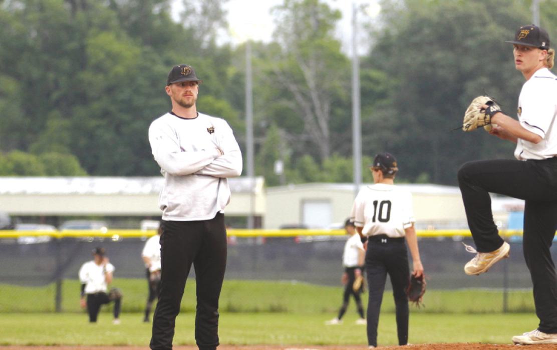 Liberty High School hired Schulenburg native Wesley Kutac as its new head baseball coach. He is pictured above observing a pitcher on his new team.