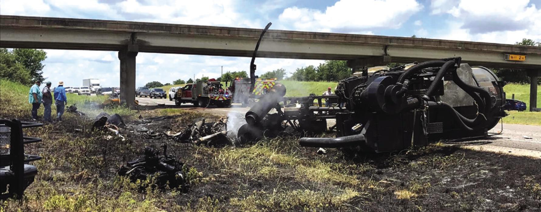 Smoking wreckage from the crash on Interstate 10 that killed Robyn Michelle Isadore, 49, of Beaumont Saturday.