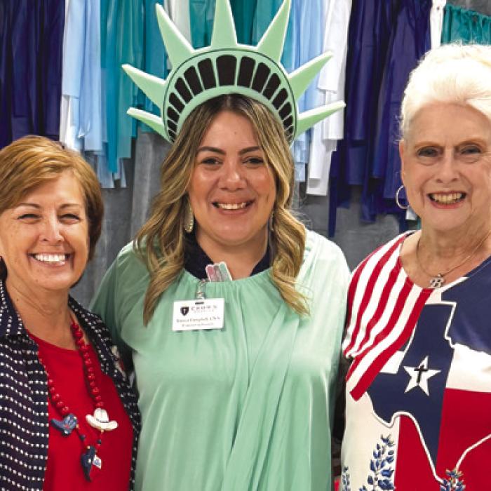 Lady Liberty, aka Jessica Campbell from Crown Hospice, is pictured here with Martha Beckmann and Betty Stolorski. Jessica was our bingo caller just before the 4th of July, and she entertained us all with her costume.