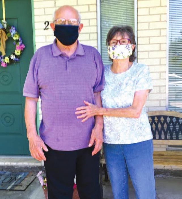 Pictured are James and Betty Miksch with a sample of the masks NVCC is making.
