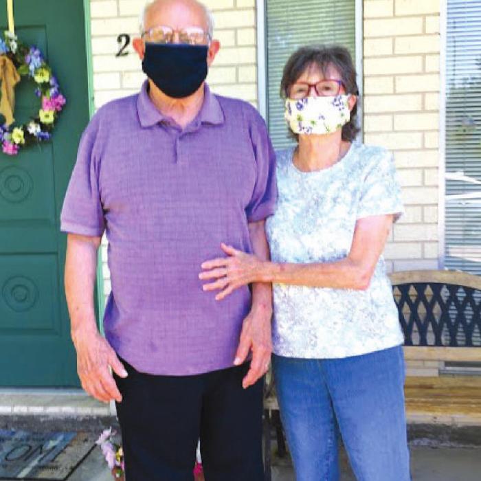 Pictured are James and Betty Miksch with a sample of the masks NVCC is making.