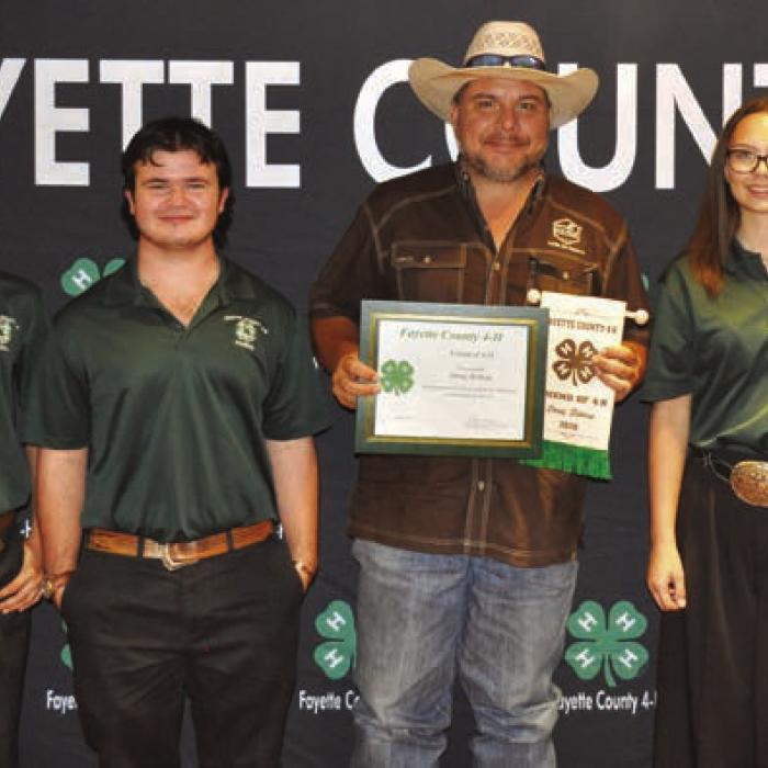 Friend of 4-H: Doug Bishop, center holding banner.