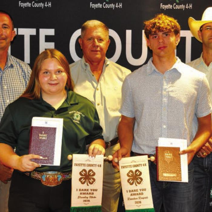 I Dare You Award, front from left: Brealey Nieto and Kandon Kaspar; back row: Commissioner Jason McBroom, Commissioner Harvey Berckenhoff, and Commissioner Clint Sternadel, presenting awards.