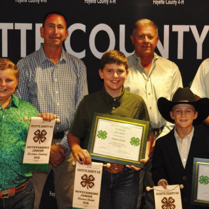 Outstanding Juniors, front from left: Stockton Emshoff, Hudson Holub, and Rowdy Guenther; back row: Commissioner Jason McBroom, Commissioner Harvey Berckenhoff, and Commissioner Clint Sternadel, presenting awards.