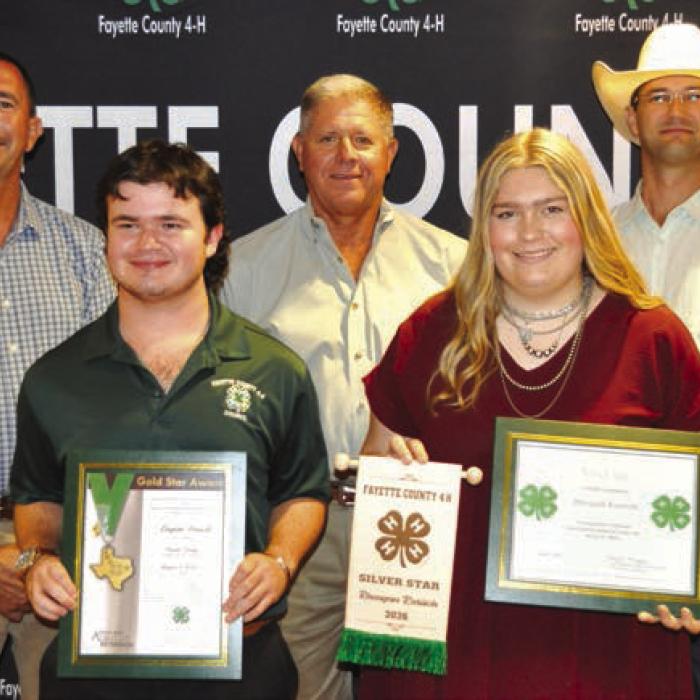 Silver and Gold Star Awards, front from left: Gold Star-Logan Poncik and Silver Star-Rheagan Karisch; back row: Commissioner Jason McBroom, Commissioner Harvey Berckenhoff, and Commissioner Clint Sternadel, presenting awards.