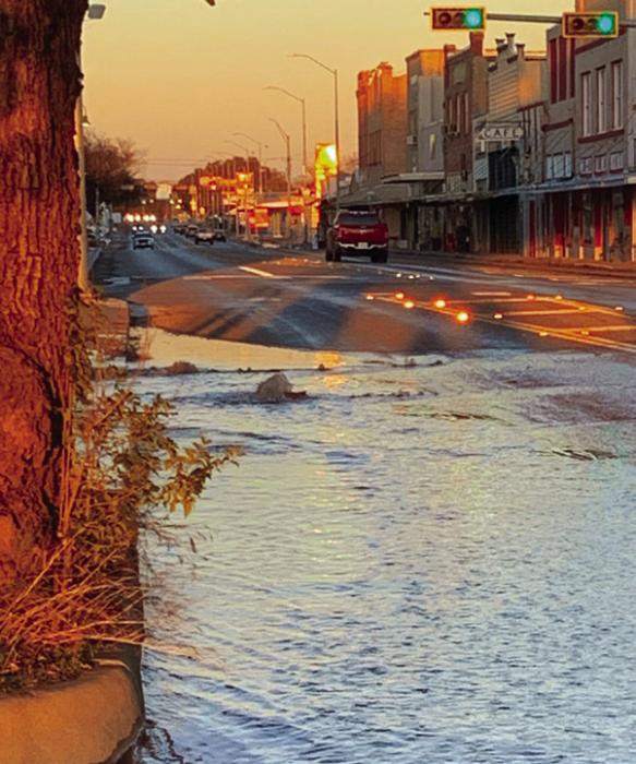 An eight-inch water main split apart under W. Travis St. just west of the courthouse square in La Grange Tuesday evening. City crews repaired the line overnight. Photo courtesy of the City of La Grange