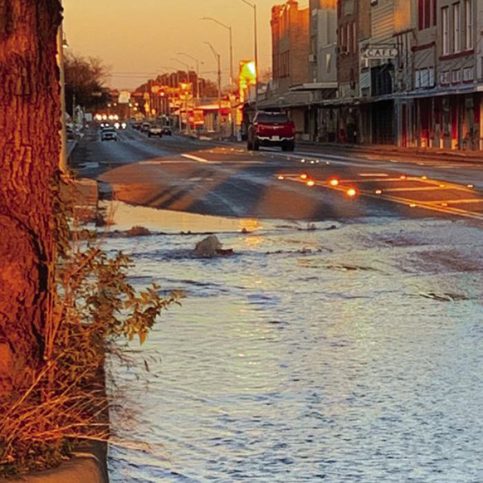 An eight-inch water main split apart under W. Travis St. just west of the courthouse square in La Grange Tuesday evening. City crews repaired the line overnight. Photo courtesy of the City of La Grange