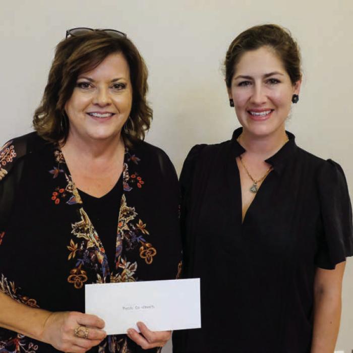 Combined Community Action (CCA) received a $2,000 grant from the Texas Women’s League. Pictured are Kelly Franke of CCA (left) and Sofia Massey of TWL.