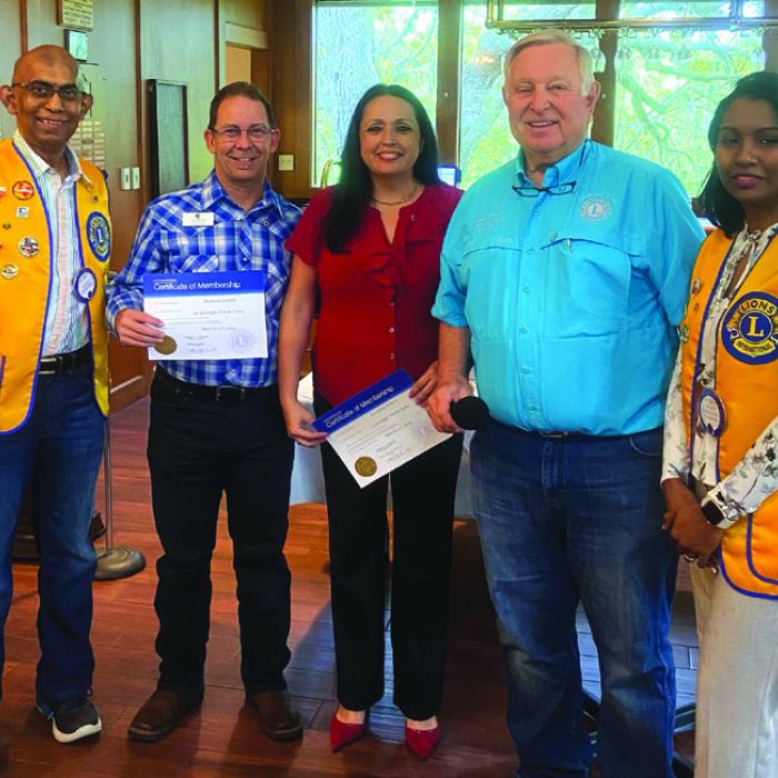 Mark Ulrich, Past District Governor inducted Damon and Roxanne Cotter to the La Grange Noon Lions Club. Their sponsors were Lions David and Deokie Ramjohn.