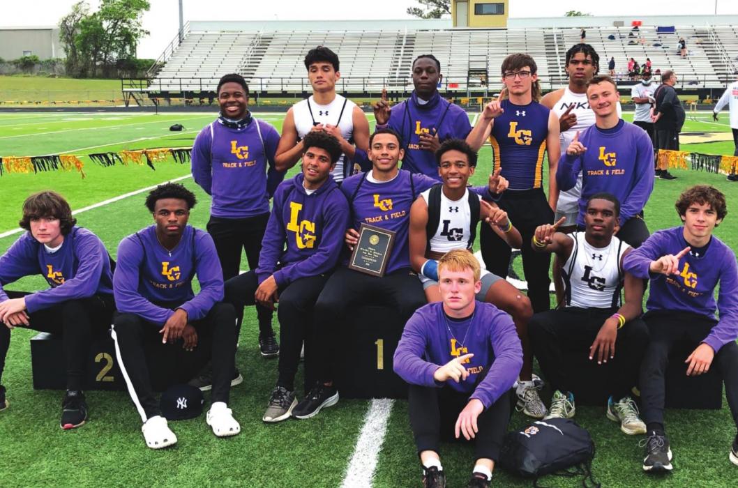 Several members of the La Grange boys track team pose with their area title after the final points were added up Wednesday at the area meet in Giddings.
