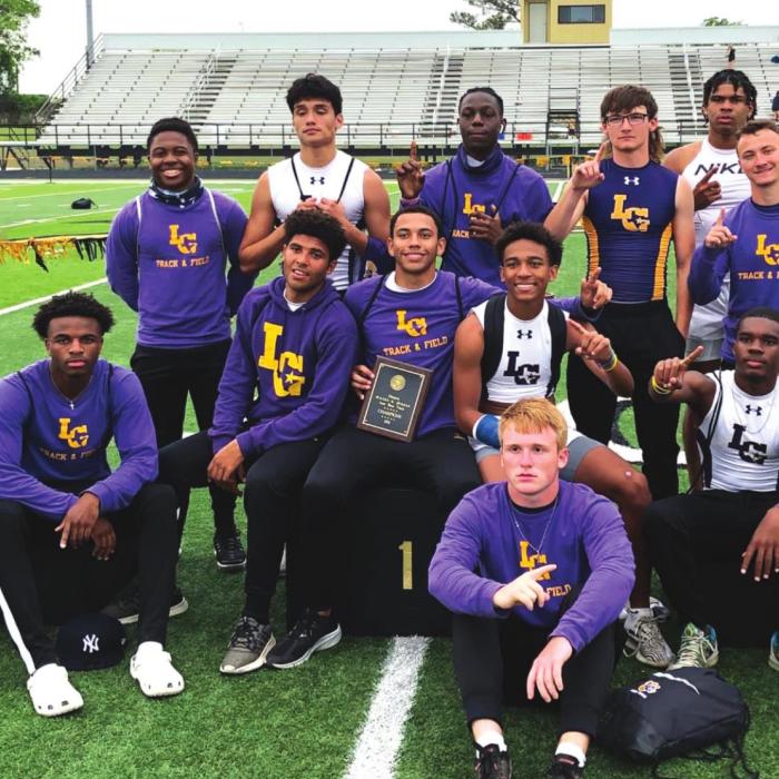 Several members of the La Grange boys track team pose with their area title after the final points were added up Wednesday at the area meet in Giddings.