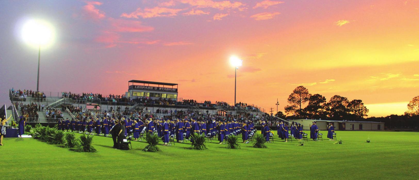 An evening of powerful storms in the area gave way to a beautiful purple and gold sunset for the graduation ceremony for the La Grange Class of 2020 Thursday. Photo by Jeff Wick