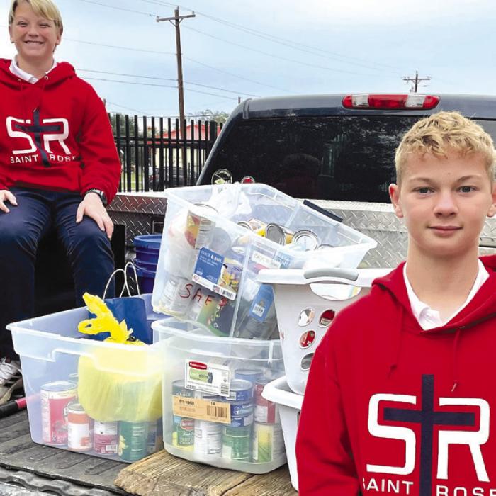 Shannon and Faras Hollas helped deliver the Thanksgiving meal baskets to St. Mark’s Medical Center. Students pictured with the delivery of canned goods to the Schulenburg Area Food Pantry are Joseph Schindler and Caden Herzik.