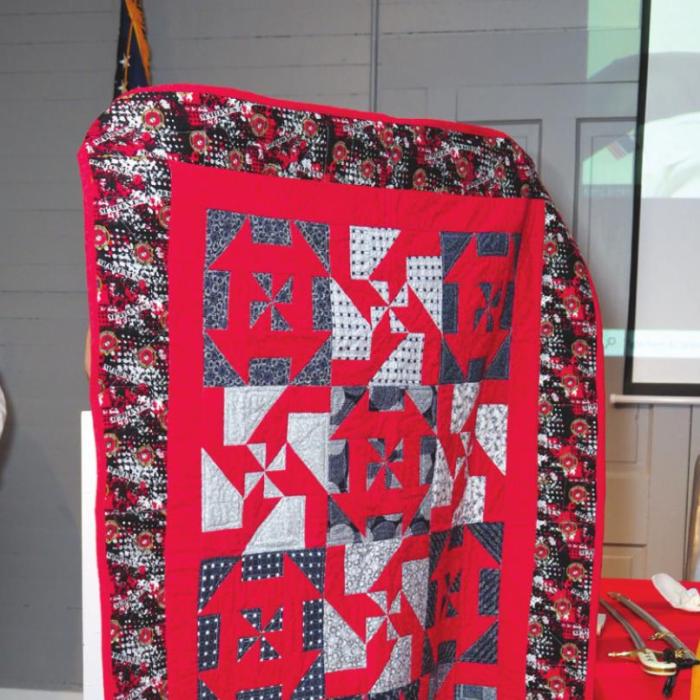 Paul Schenck participated via Zoom and was presented a handmade quilt by the organization “Quilt for Vets.”