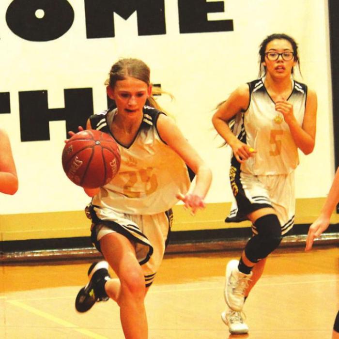 Round Top-Carmine’s Tess Eilers dribbles the ball as Fayetteville’s Emma Jurecka, left, and Rylie Dyer, right, converge defensively. Photo by Jeff Wick