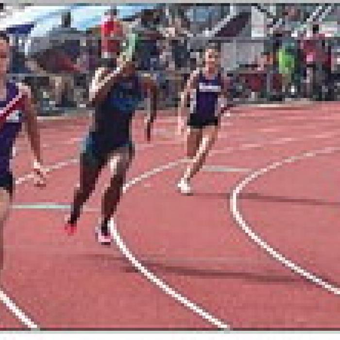 About 150 local kids are participating in the La Grange Optimist Club summer track program. Their first of four meets this month was Saturday in Columbus (above). Photo by Jeff Wick