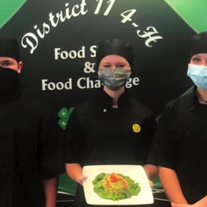 District 11 4-H Food Challenge winners: The Simmer Down team of Logan Poncik, Harper Mau, and Addie Kibby.
