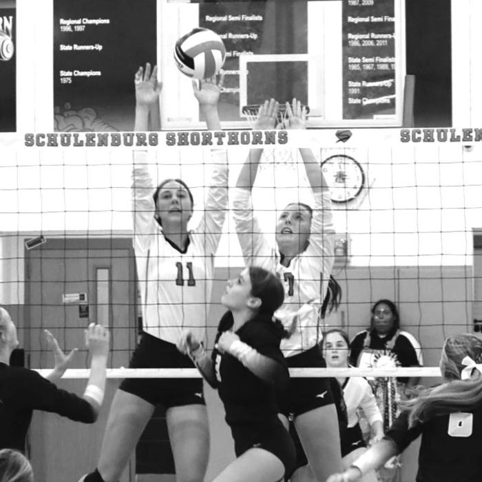 Meredith Magliolo (11) and Mackenzie Kunschick (17) of the Schulenburg volleyball team get above the net in last Friday’s victory over Round Top-Carmine. Photo by Audrey Kristynik