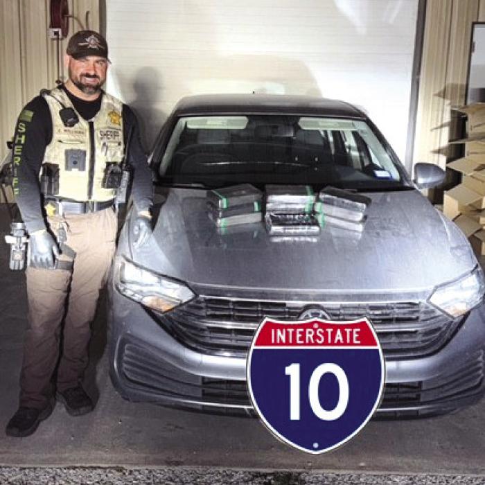 Deputy Cody Williams pictured with the cocaine seizure.