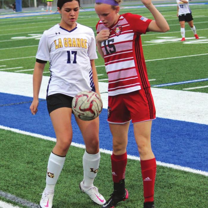 La Grange’s Jolie Gutierrez and a Salado player battle for the ball while trying to keep it from going out of bounds Tuesday. Photo by Jeff Wick