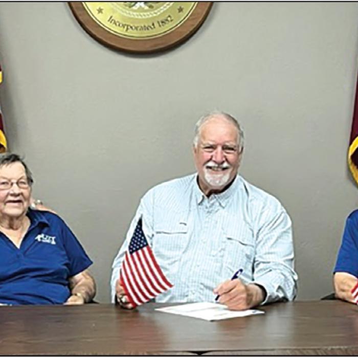 KJZT Proclamation of the flag for Flag Day. Pictured left to right are Lois Kaspar, Mary Jane Toddy, Mayor Stroup, Helen Weid and Rose Rohde (back).