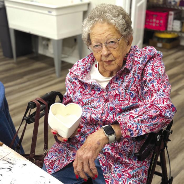 Irene Janda is pictured here with a bisque bowl that she is contemplating what color scheme she will glaze. It’s sure to be pretty, she has a creative imagination. Irene is one of many seniors that participate in the Artful Fridays At Arts For Rural Texas campus.