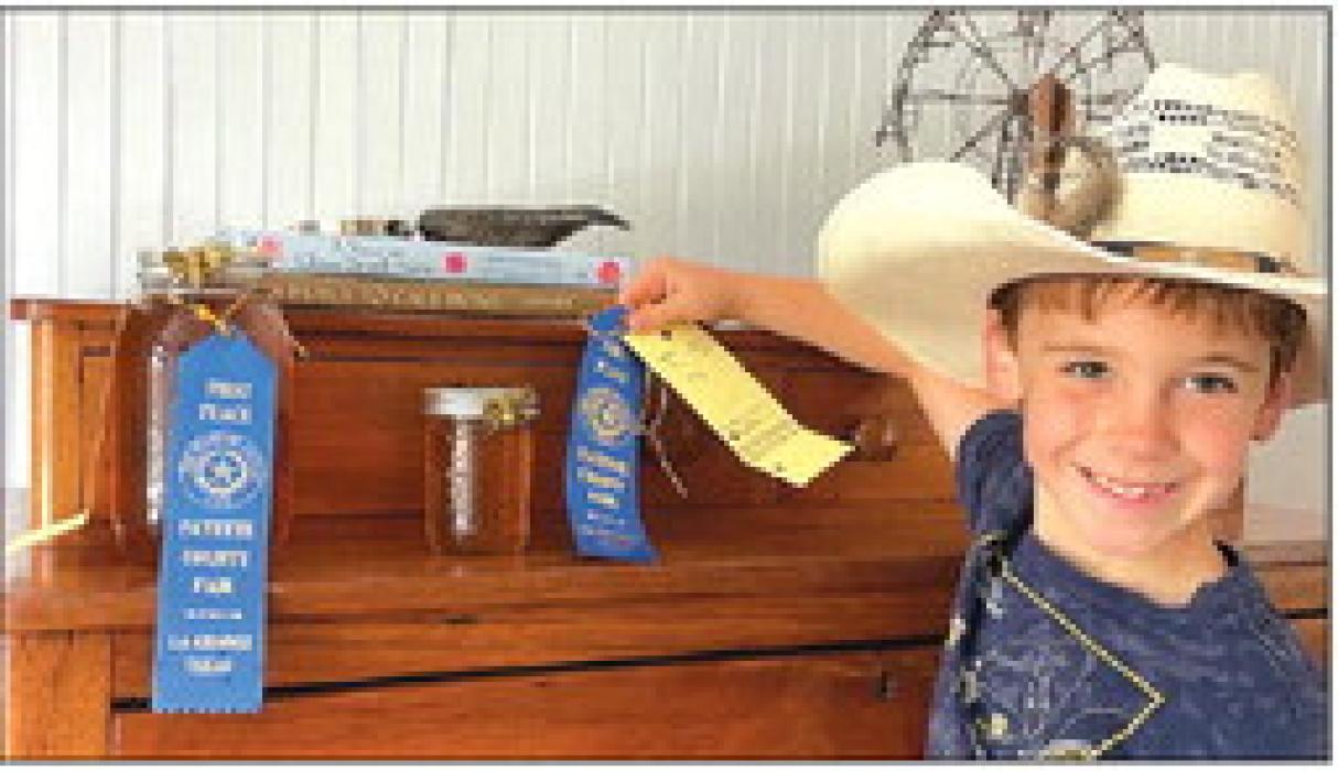 Emerson Parry with his 1st place winning honey.